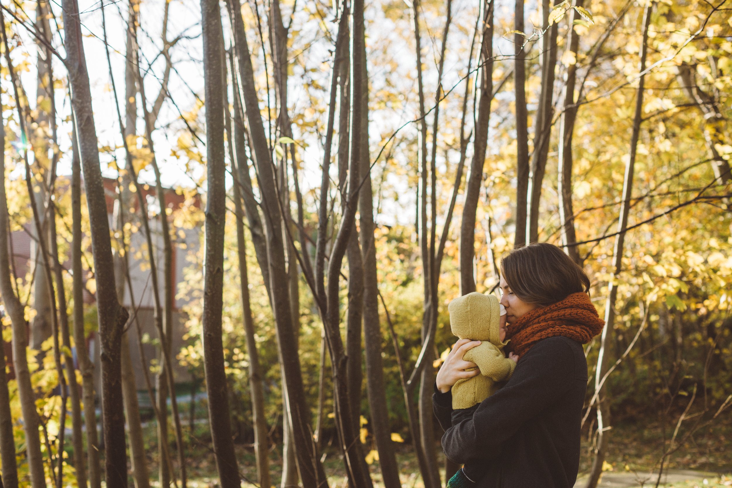 Woman walking in forest with small child
